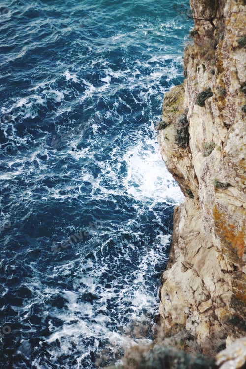 Preview: NOMINATED 💦
water and stone, a wave beats on the rocks, blue water