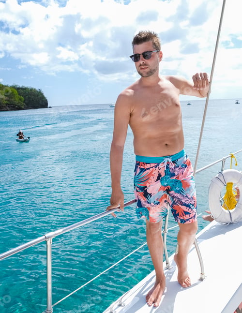 Preview: young men in swimshort on vacation on a boat trip Saint Lucia, luxury holiday Saint Lucia Caribbean