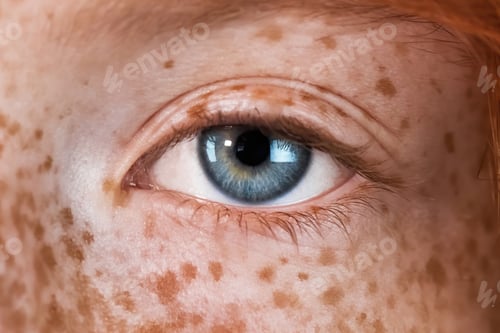 Preview: Blue eye of a red-haired girl