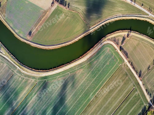 Preview: Drone shot of a river in a field