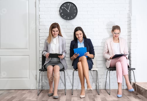 Preview: Young women waiting for job interview, indoors