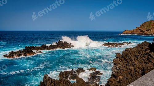 Preview: View of the ocean with some crashing waves hitting the rocky shoreline