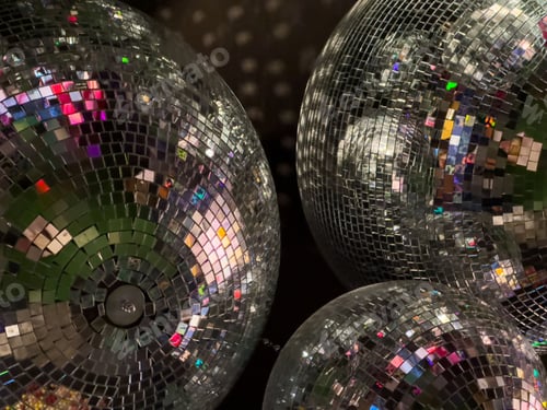 Preview: Vibrant closeup of colorful disco balls.