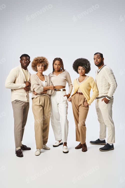 Preview: group of happy african american people standing with hands in pockets on grey background, Juneteenth