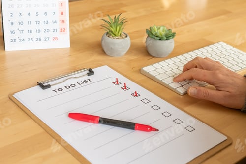 Preview: Person completing tasks on to do list planning daily schedule