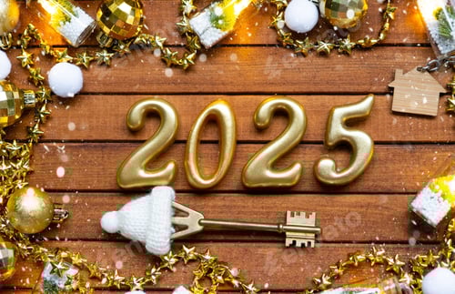 Preview: House key with tiny figure of home mock up on festive brown wooden background, lights of garlands. N