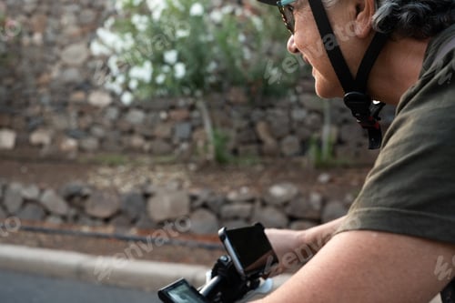 Preview: Close up on devices of e bike. People enjoying bicycle with the cellphone recording the street.