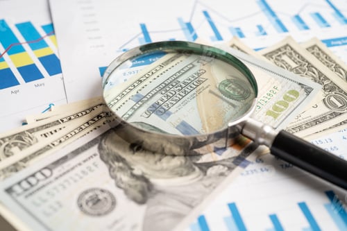 Preview: Magnifying glass on chart graph for analysis account business trade.