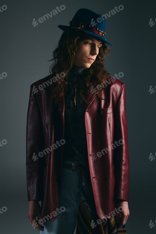 Preview: Stylish young man exudes confidence in a fashionable outfit with a unique flair