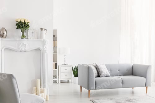 Preview: Pillows on grey settee and chair in bright white living room int