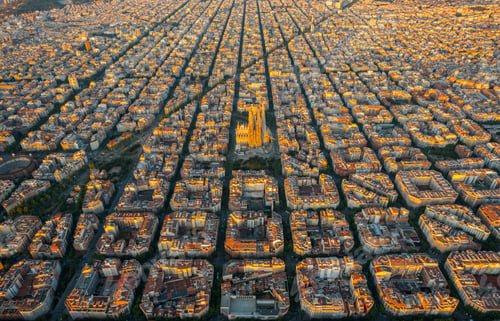 Preview: Aerial view of Barcelona Eixample residential district and Sagrada Familia Basilica at sunrise