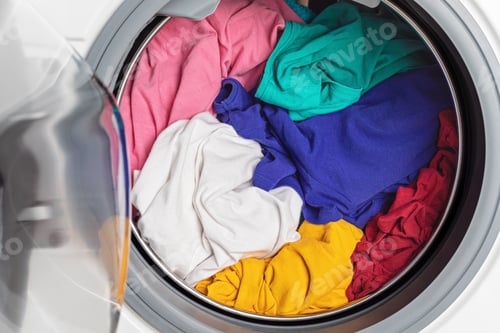 Preview: Washing or drying machine loaded with the laundry. Washing, spring cleaning idea
