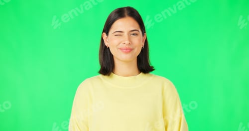 Preview: Happy, woman and face wink on green screen, studio and color background. Portrait, female model and