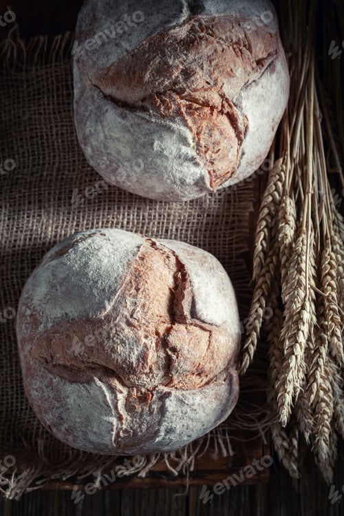 Preview: Delicious loaf of bread on dark and rustic table