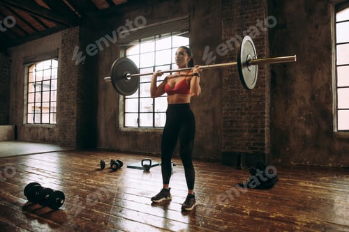 Preview: female bodybuilder training at the gym