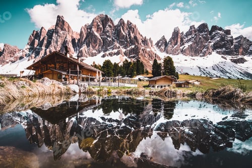 Preview: Beautiful high mountains with snowy peaks and the cloudy sky in the background