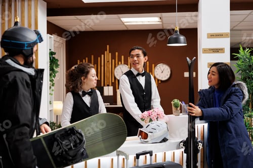 Preview: Couple assisted by hotel receptionists