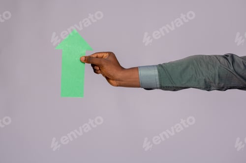 Preview: black man holding an arrow pointing upwards
