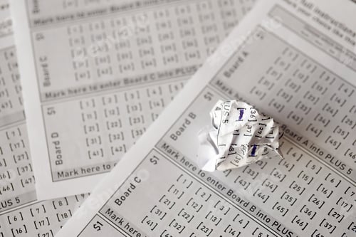 Preview: Crumpled lottery tickets as symbol of losing the lottery game. Unlucky gambling results. Misfortune