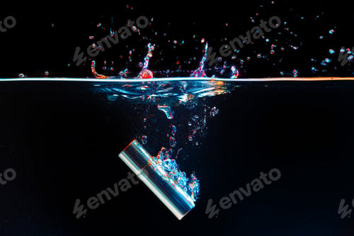 Preview: Lipstick case falling into the water with a splash