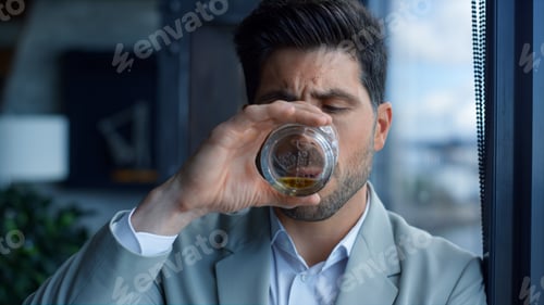 Preview: Rich man drinking cognac in luxury interior portrait. Businessman relaxing