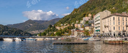 Preview: Pier and boats docked at marina on Lake Como in the harbor of the city of Como