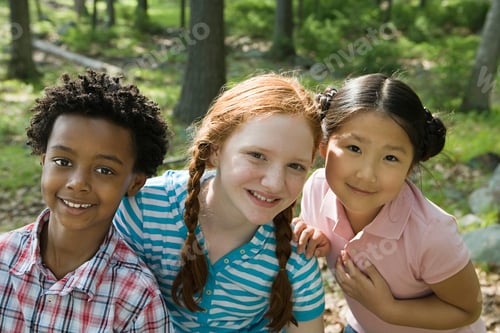 Preview: Three smiling children enjoying nature together