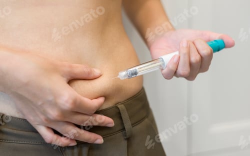 Preview: woman using IVF treatment injection on belly to prepare reproductive fertility