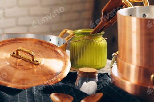 Preview: Copper cookware with wooden kitchen utensils close up