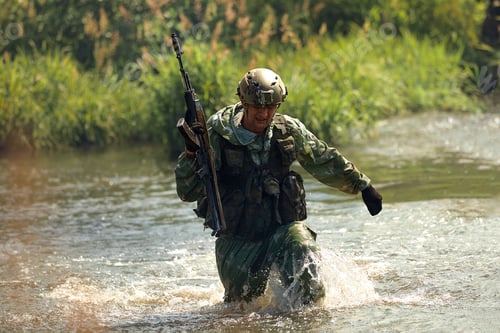 Preview: Special forces soldier with weapon take part in military maneuver. War, army, technology and people