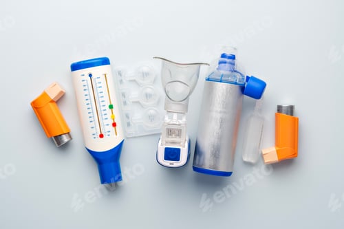 Preview: Inhalers, nebulizer mask, plastic blister pack, peak flow meter, and metal spacer