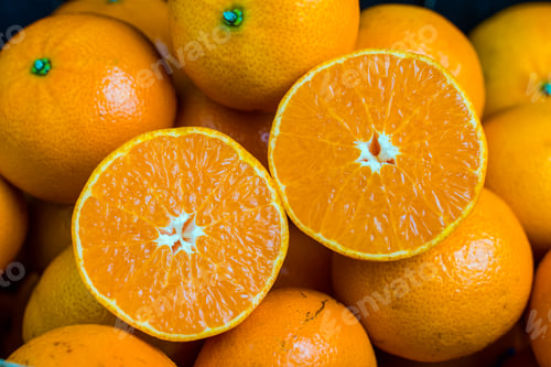 Preview: Close up of Orange cut in half for background, orange flesh.