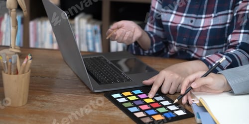 Preview: designer graphic creative creativity working together coloring using graphics tablet and a stylus at