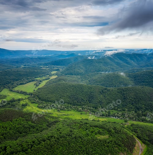 Preview: Aerial view with spring mountain