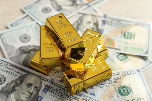 Preview: Shiny gold bars and dollar banknotes on table, closeup