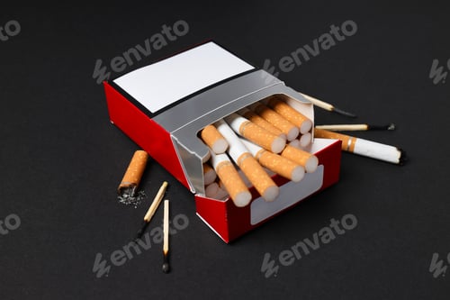 Preview: A pack of cigarettes with matches on a dark background