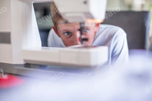 Preview: Boy examining sewing machine