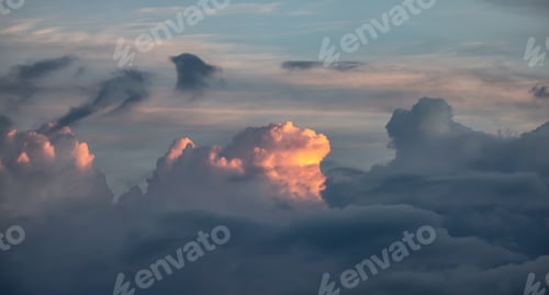 Preview: Dramatic Puffy Clouds during Sunrise. Nature Background Cloudscape