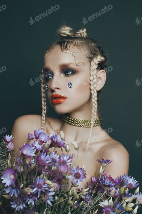 Preview: Fashionable Female Portrait In Studio With Hair, Make-Up And Flowers