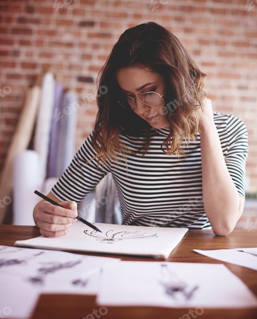 Preview: Pensive woman working on important project