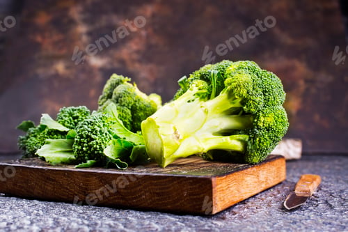Preview: raw broccoli on wooden board, diet food,