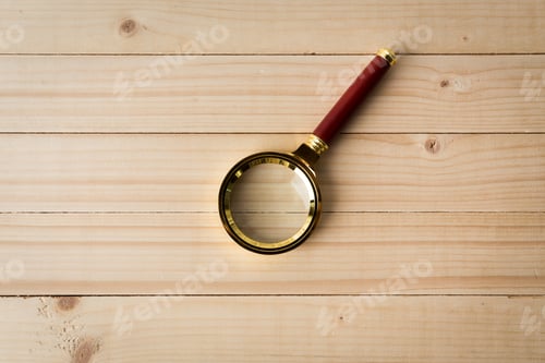 Preview: magnifying glass on wooden table