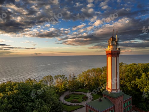Preview: Beautiful lighthouse at sunset in Rewal at Baltic Sea.