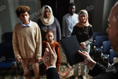 Preview: Priest reading sermon for people