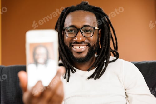 Preview: African man taking a selfie.