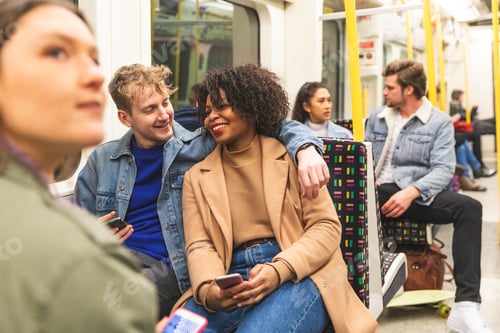 Preview: Multiracial couple travelling by tube together