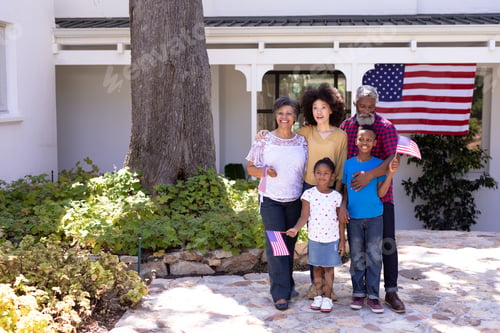 Preview: Multi-generation mixed race family enjoying their time at a garden