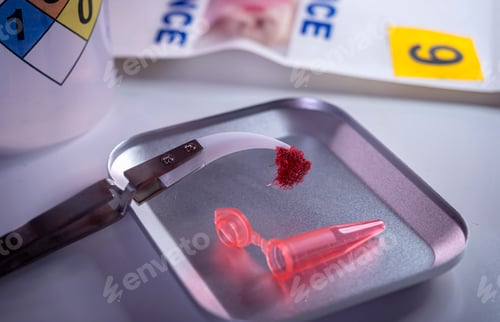 Preview: Police scientist examines bloodstained gauze from a drug overdose case, conceptual image