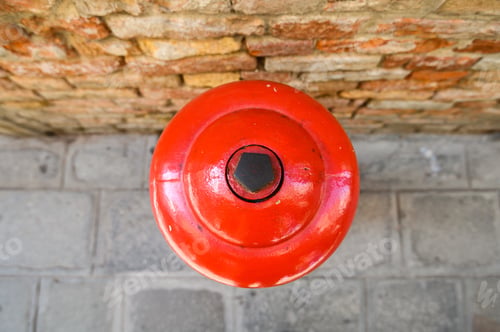 Preview: Classic red hydrant in the street of Venice. Italy.