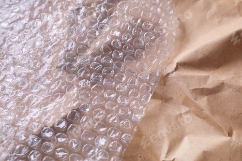 Preview: Transparent bubble wrap on kraft paper, closeup